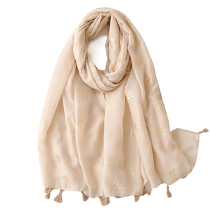 Lightweight beige cotton linen scarf with golden swallow pattern and fringe trims