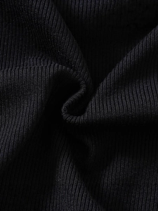 Close-up of black ribbed knit fabric on girls summer dress with soft texture details