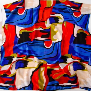 Detailed view of vibrant oil painting style linen shawl with colorful artistic prints