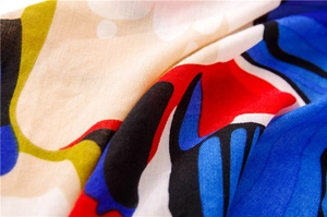 Detailed close-up of vibrant oil painting style pattern on bohemian linen cotton scarf