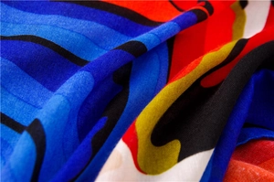 Detailed close-up of vibrant oil-painting texture on colorful cotton-linen scarf