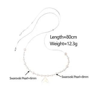 Adjustable pearl necklace with iridescent shell fishtail pendant on white backdrop