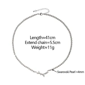Collier de perles vintage français avec pendentif nœud étincelant et chaîne ajustable