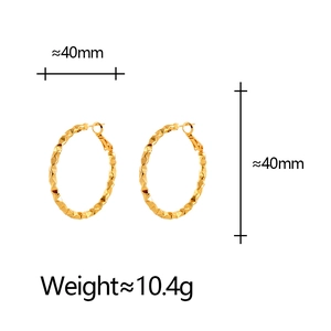 Detail view of 40mm golden textured hoop earrings with faceted design and weight specs
