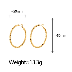 Detail of 50mm gold hoop earrings with pleated geometric texture and 13.3g weight