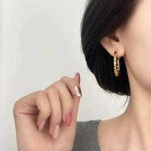 Fashionable gold hoop earrings with 3D pyramid textured surface for daily wear