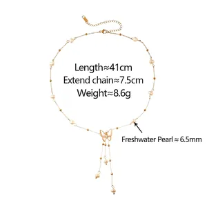Elegant gold butterfly tassel necklace featuring white freshwater pearls and shell wings