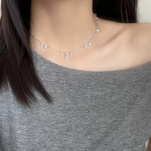 Elegant silver teardrop zircon necklace on neck for daily minimalist fashion look