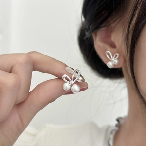 Elegant rabbit ear silver stud earrings with lustrous white pearls for women