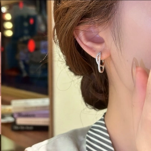 Silver double layer hoop earrings with micro-set zircons on a female model side view