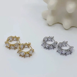 Chic gold and silver C-shaped hoop earrings with sparkling heart-cut cubic zirconia stones