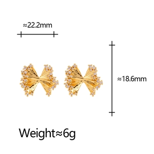 Exaggerated golden zircon bow earrings with folded metal texture and size measurements