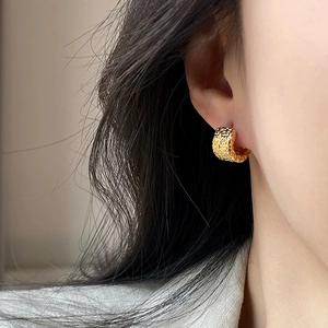 French style gold textured C-shape hoop earrings with lava hammered metal finish