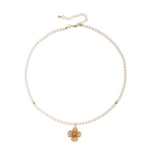 Elegant pearl necklace with golden flower pendant and beads on a clean white background