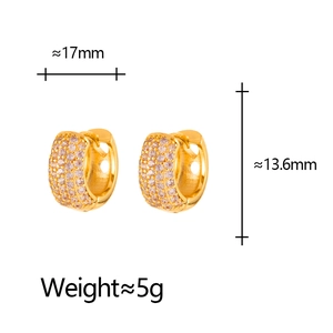 Detailed view of huggie earrings with pink zircons and size specs: 17mm width