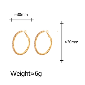Detail of 30mm gold hoop earrings with zircon pavé showing diameter and weight info