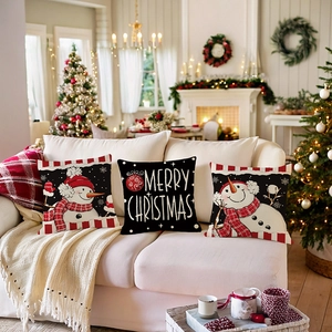 Three-piece Christmas linen cushion covers with snowman motifs and red plaid borders