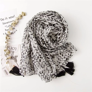 Lightweight cotton linen shawl scarf with black leaf patterns and tassel edges