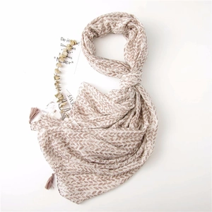 Floral cotton linen scarf for women featuring leaf patterns and elegant tassel details