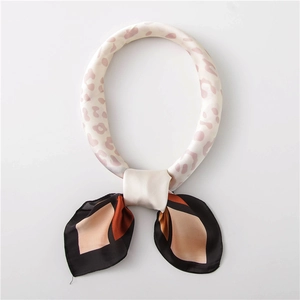 Detailed view of vintage cotton linen scarf featuring leopard print rings and geometric patterns