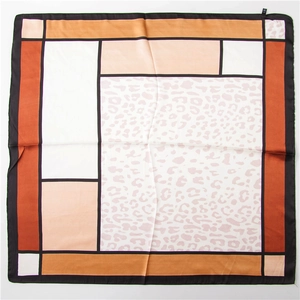 Close-up of leopard and geometric block pattern on a square cotton linen scarf