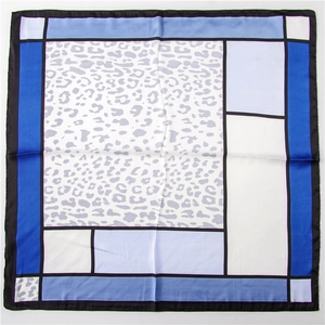 Detail of square scarf featuring geometric color blocks and trendy leopard print textures