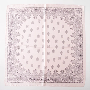 Flat lay of square pink paisley silk scarf with bohemian vintage floral border patterns