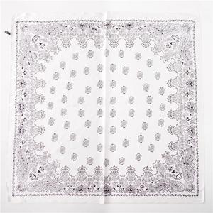 Detail of white square bandana with purple paisley pattern and small side label