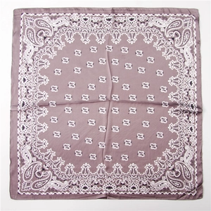Close-up of square lavender paisley silk scarf with glossy finish on a white background