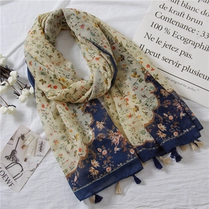 Floral cotton linen scarf with blue borders and tassel ends for women's spring fashion