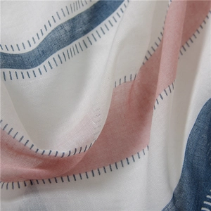 Detailed macro view of soft cotton-linen scarf with pink and navy wavy stripes texture