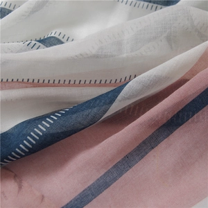 Close-up of lightweight cotton linen scarf with blue stripes and woven texture details