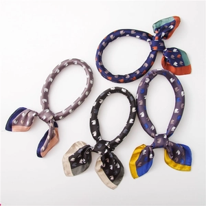 Elegant satin scarves with horse head prints and contrasting edges in four color variants