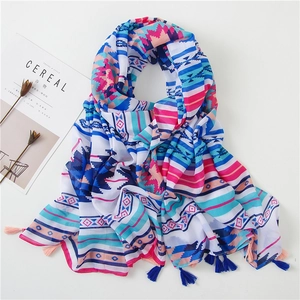 Bohemian style linen scarf with colorful geometric prints and tassels on white background