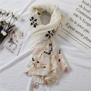 Bohemian off-white printed scarf with fringe tassels and geometric floral pattern
