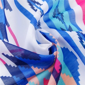 Macro view of ethnic style cotton linen scarf showing geometric prints and soft texture