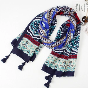 Detailed view of bohemian floral cotton linen scarf with deep blue fringe tassels