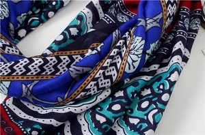 Close-up of bohemian style scarf showing vibrant geometric prints and textile texture