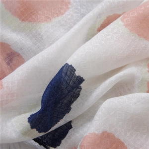 Macro shot of breathable cotton linen fabric with pink and navy abstract polka dot patterns