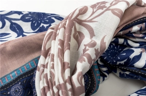Close-up of blue and pink floral linen scarf showing fine fabric texture and hemmed edges
