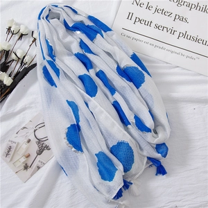 White linen scarf with large blue polka dots, silver glitter edges and tassels