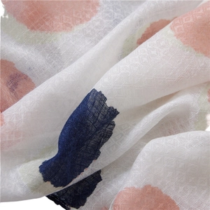 Lightweight cotton linen scarf with colorful polka dots showing soft fabric textures