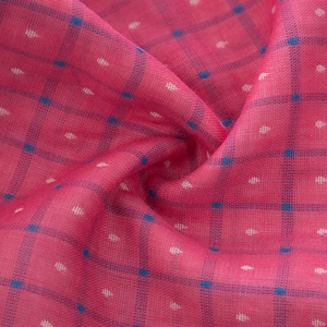 Detail of soft checkered cotton scarf fabric with pink mesh and polka dot texture