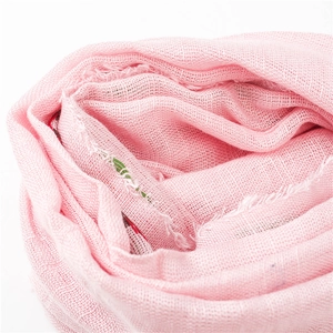 Detail of pink cotton linen scarf showing soft woven texture and subtle colorful lines