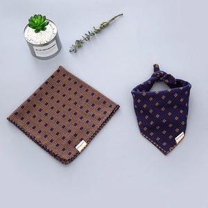 Detail view of two soft cotton scarves featuring brown plaid and blue geometric patterns