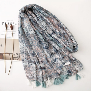 Bohemian printed cotton linen scarf with geometric patterns and tassels on white background