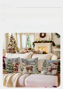 Detailed view of three festive linen pillow covers with Santa, Reindeer and Snowman prints