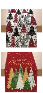 Detail of Christmas table runners with festive tree patterns and Merry Christmas text