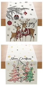 Detailed fabric texture of Christmas table runners with reindeer and tree patterns