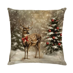 Vintage Christmas pillow case featuring a reindeer and snowy tree on linen texture